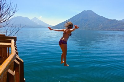 jumping from the dock at the nature reserve in san marcos lake atitlan