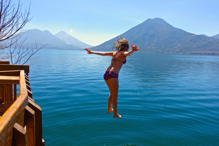 jumping from the dock at the nature reserve in san marcos lake atitlan